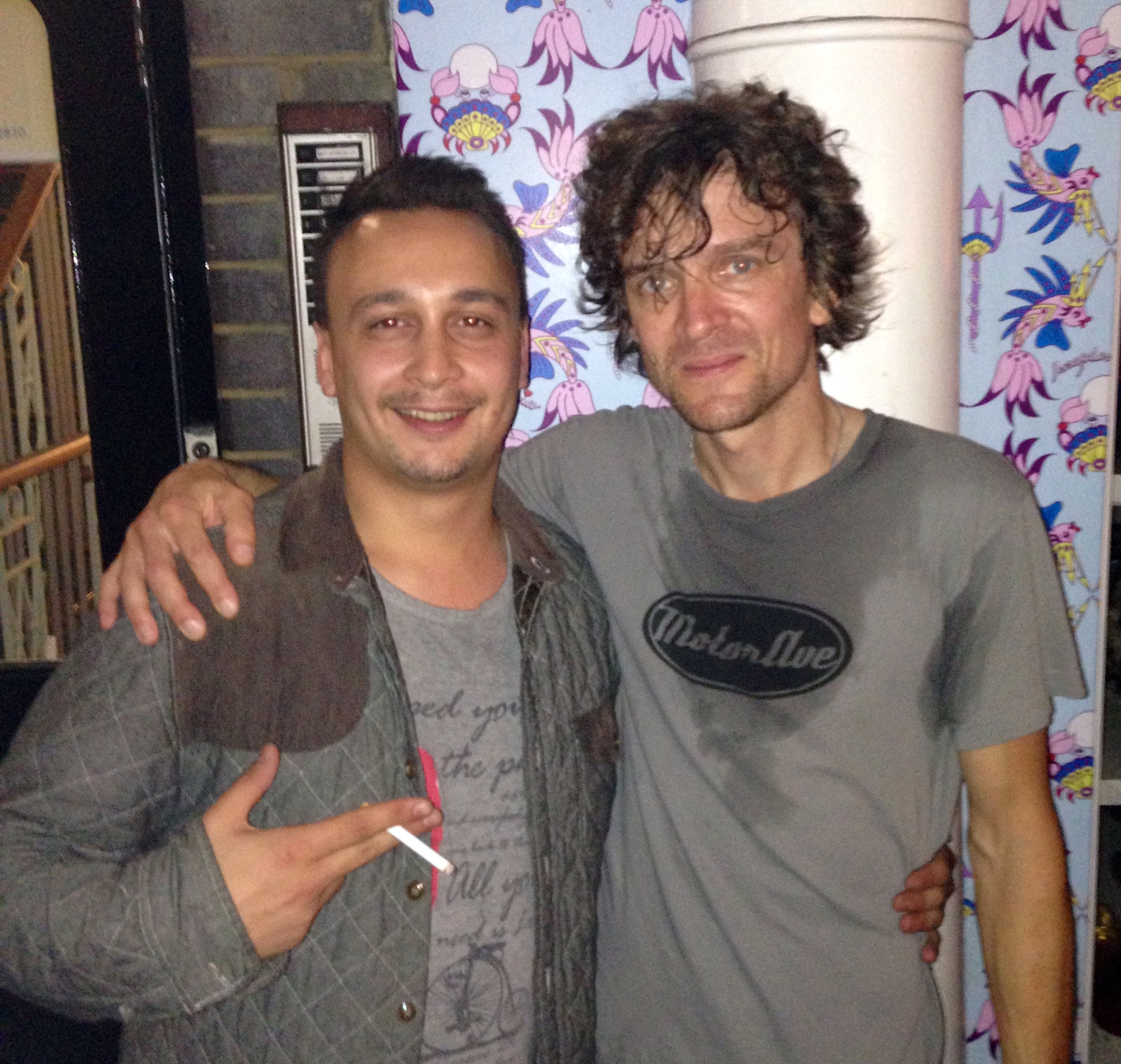 Michael Darius Eastwood with Brendan Benson of The Raconteurs, arms round shoulders at a London venue